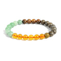 Money Magnet Bracelet on a white background showing green aventurine, pyrite, citrine and tiger eye beads