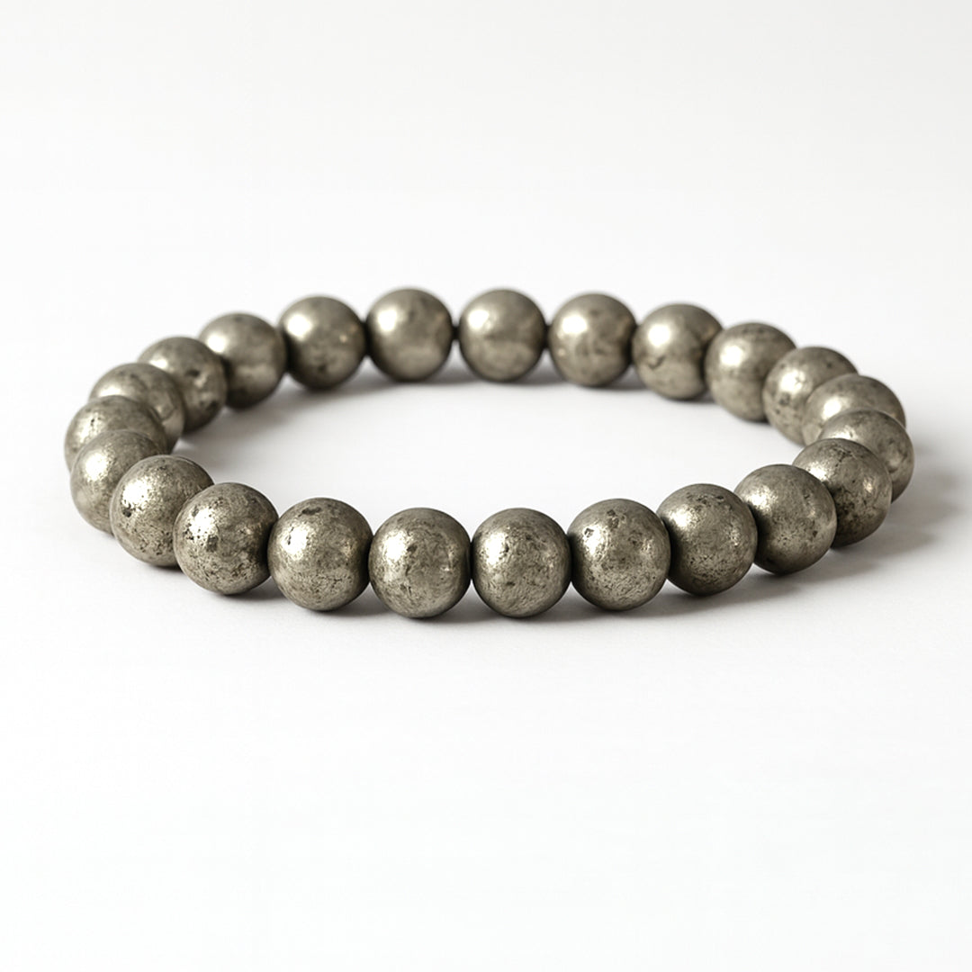 Raw Pyrite Bracelet (Dhan Shakti) on a white stand, natural certified pyrite beads