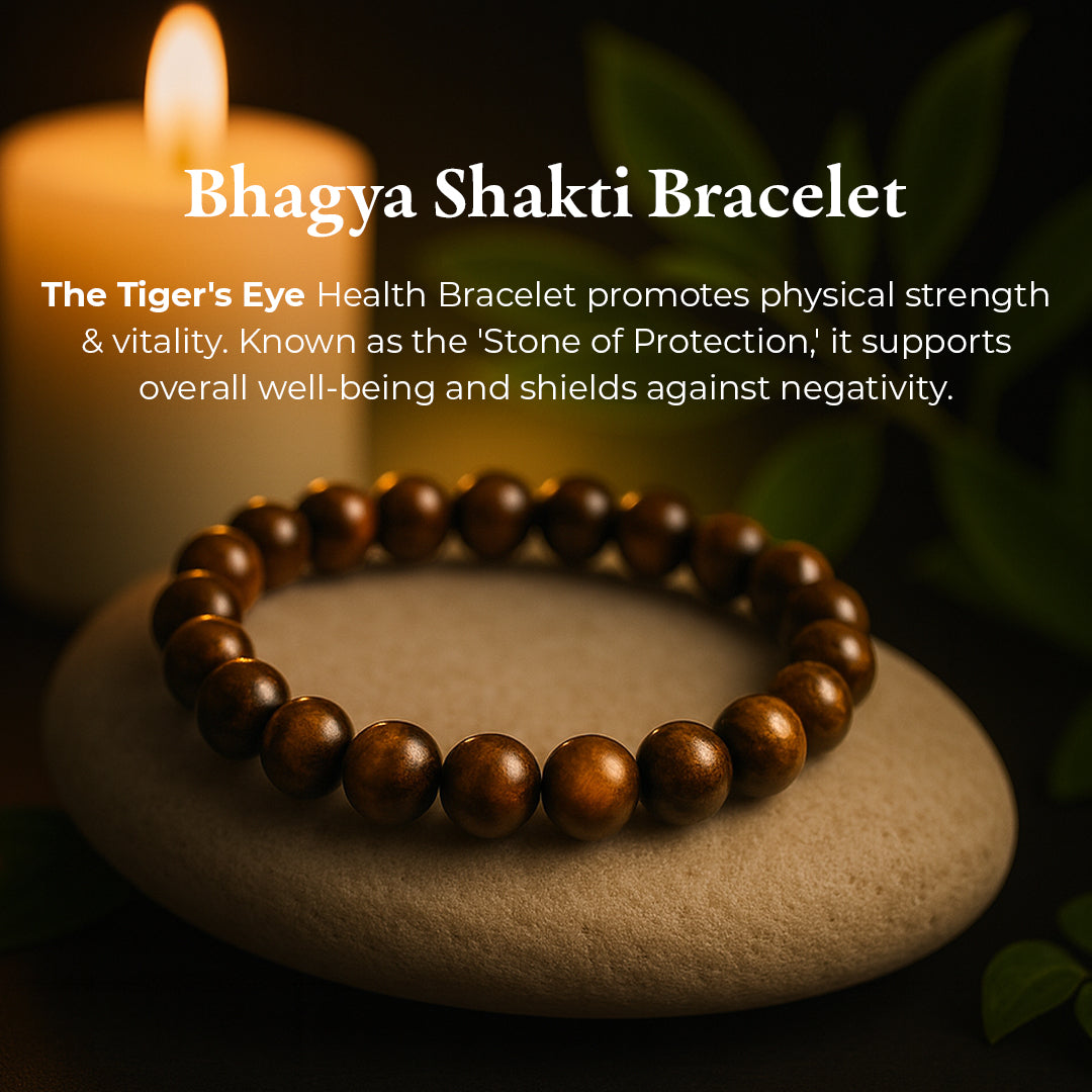 Tiger Eye Bracelet (Bhagya Shakti) resting on a stone, golden-brown chatoyant tiger eye beads