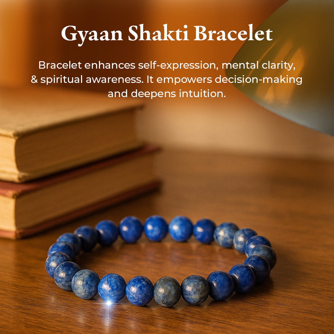 Lapis Lazuli Bracelet (Gyaan Shakti) resting on books, deep blue lapis lazuli beads