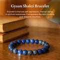 Lapis Lazuli Bracelet (Gyaan Shakti) resting on books, deep blue lapis lazuli beads