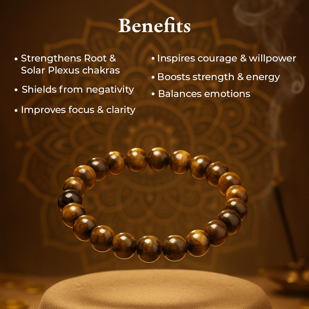 Tiger Eye Bracelet (Bhagya Shakti) resting on a stone, golden-brown chatoyant tiger eye beads